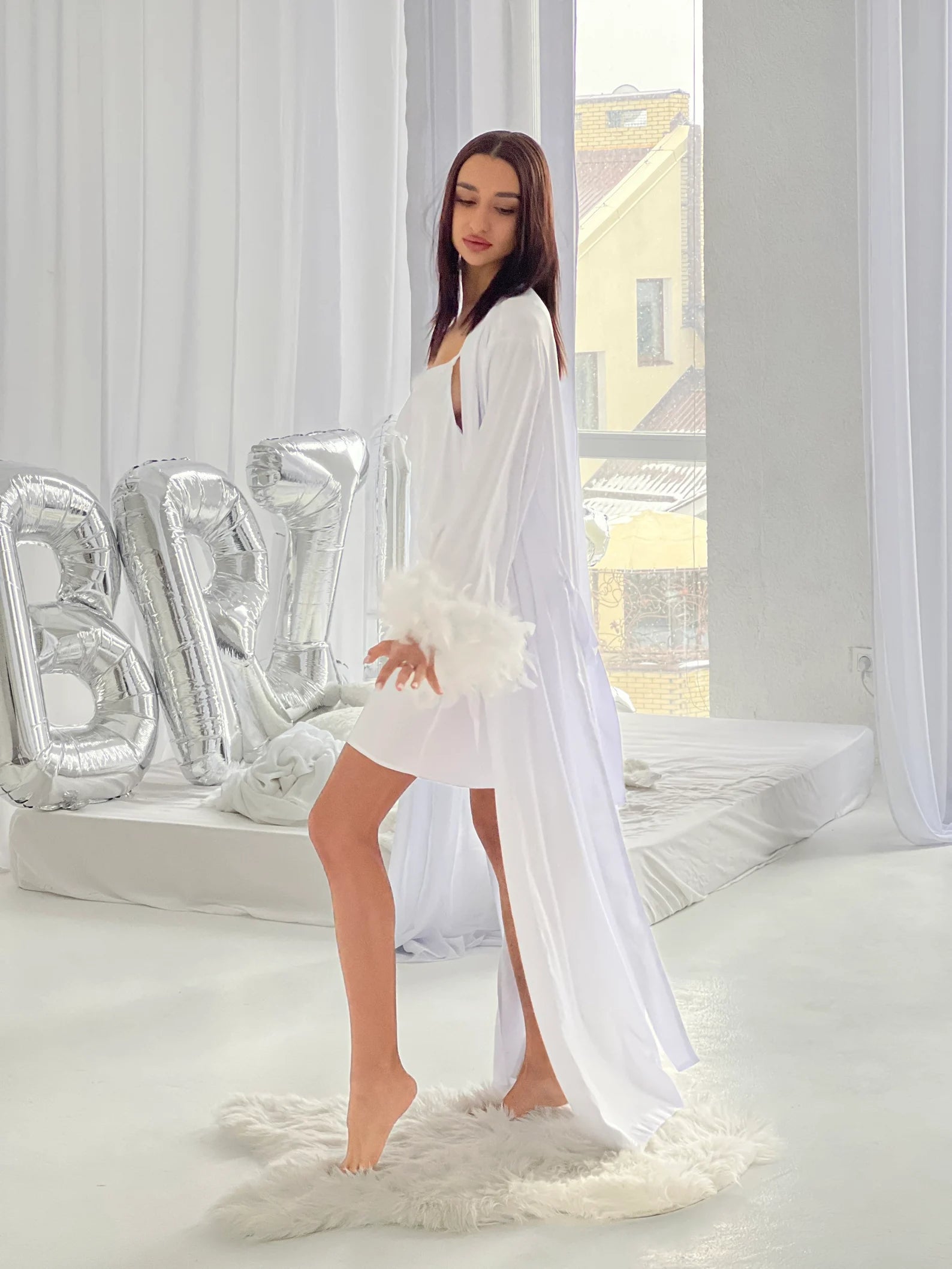 Bridal robes with feather sleeves for final fiesta bachelorette party